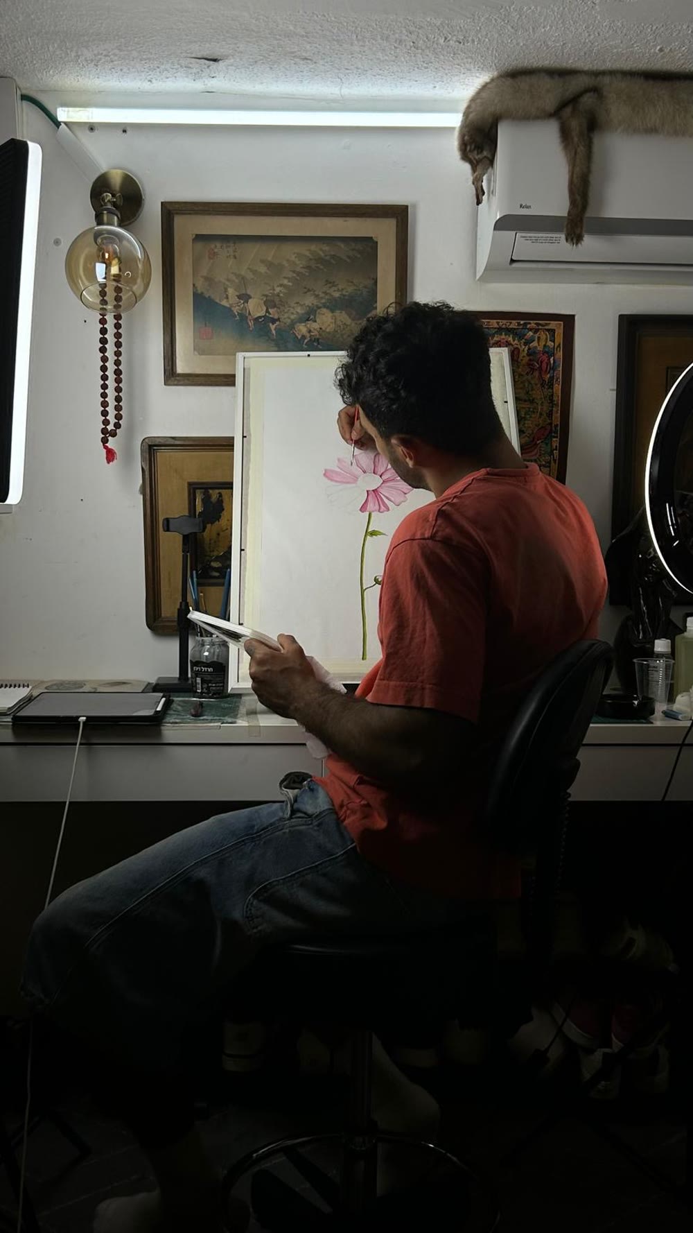 Bar, founder of Bear Studios, painting in the studio