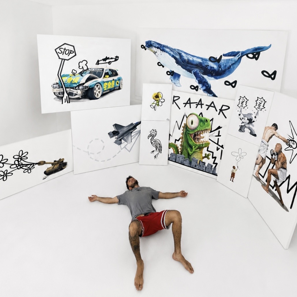 Bar, founder of Bear Studios, lying among original paintings